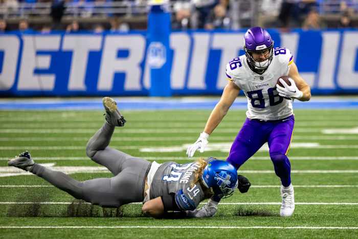 Jan 7, 2024; Detroit, Michigan, USA; Detroit Lions linebacker Alex Anzalone (34) dives and tackles Minnesota Vikings tight end Johnny Mundt (86) during second half at Ford Field.